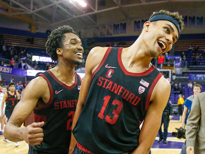 Stanford Cardinal forward Oscar da Silva (13) and guard Bryce Wills (2) celebrate a win in 2019.